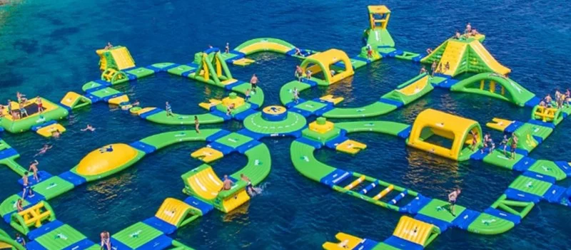 Water Parks with Floating Obstacle Courses and Slides for Family Fun